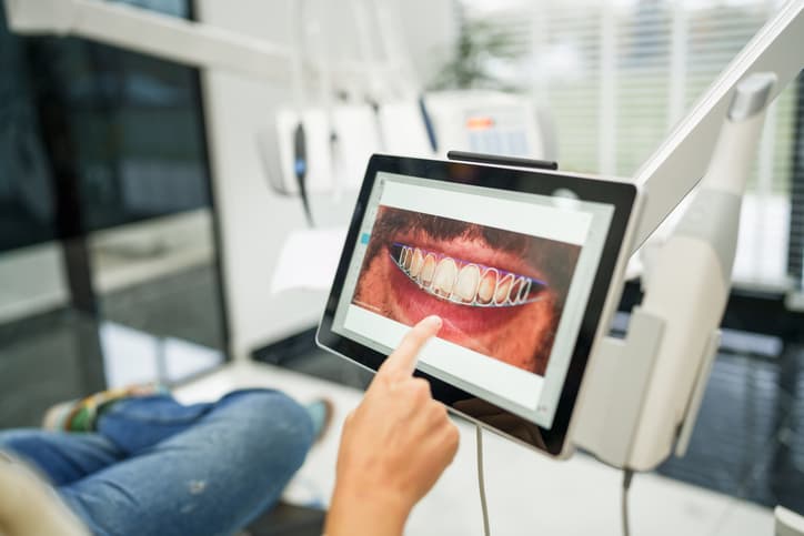 Dentist reviewing a digital scan on a tablet