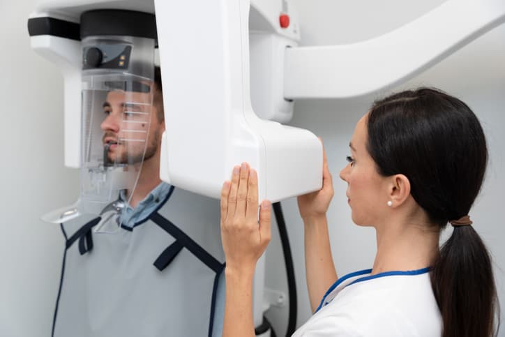 Patient receiving three-dimensional dental imaging